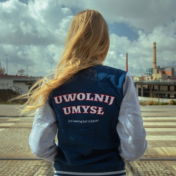 A girl wearing a sweatshirt with the words "Free your mind"