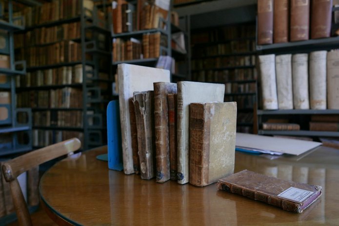 Valuable items from the collection of the University of Lodz Library. Book spines visible.