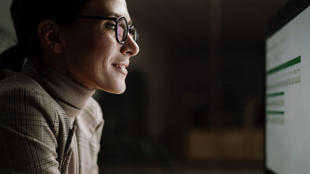  a woman looking at a monitor