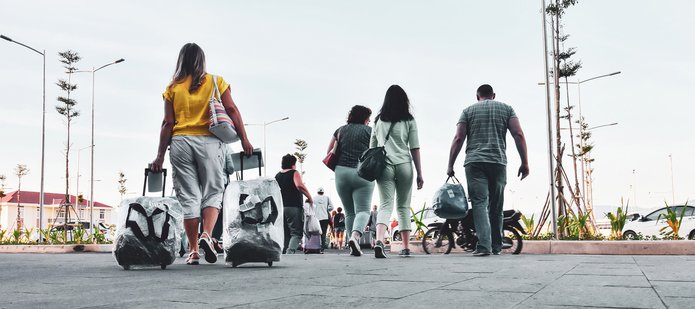a decorative element: People travelling with luggage
