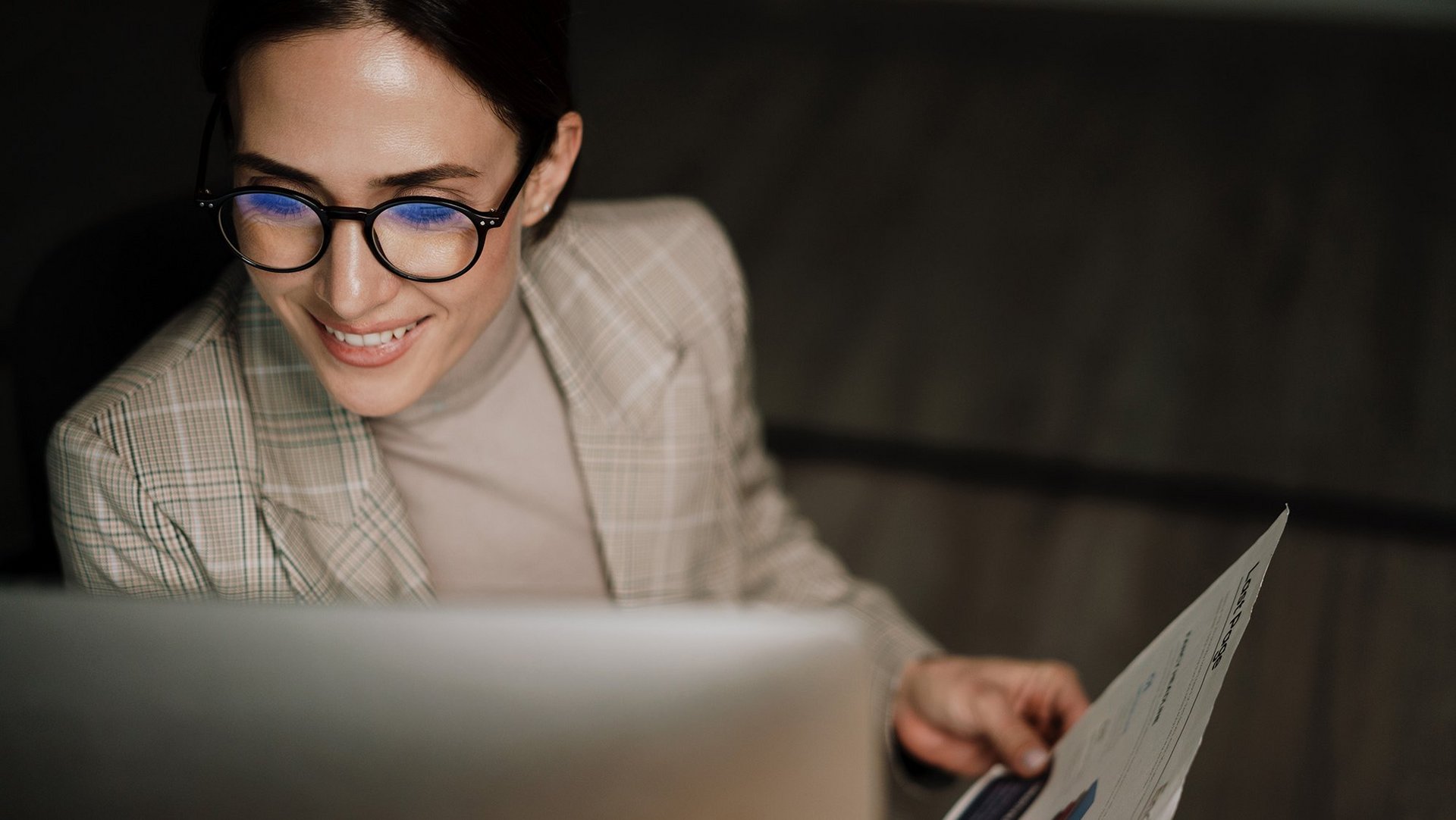a decorative element: a woman looking at the computer screen