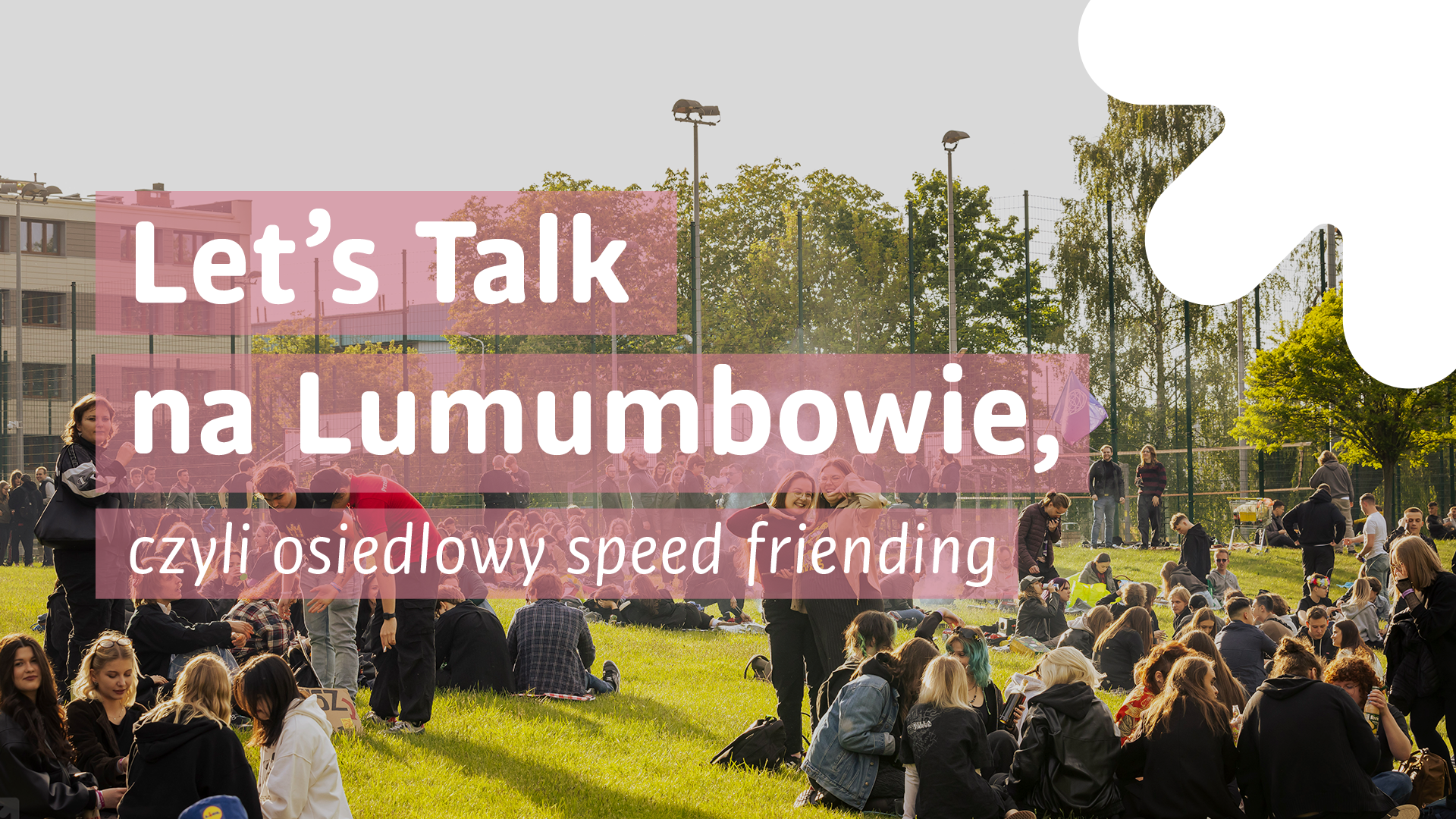 Smiling students and a sign reading "Let's talk at Lumumbowo, i.e. Neighbourhood Speed-Friending"